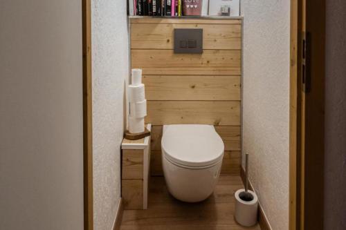 a small bathroom with a white toilet in a room at Cocoon In Megève in Megève