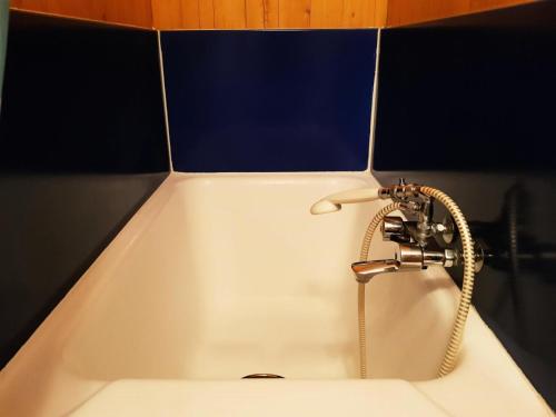 a sink with a faucet in a bathroom at Résidence Cascade - Studio pour 3 Personnes 41 in Arc 1600