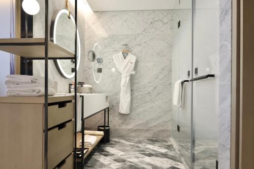 a bathroom with a shower and a sink at Crowne Plaza Quanzhou Riverview by IHG in Quanzhou