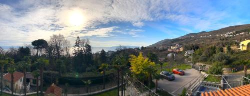 a view of a town with a mountain at Apartments & Rooms Ribarić in Lovran