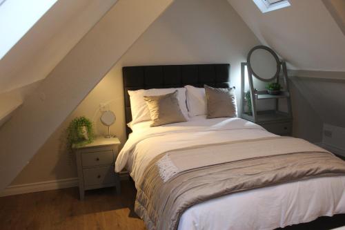 Ένα ή περισσότερα κρεβάτια σε δωμάτιο στο Jacob Cottage