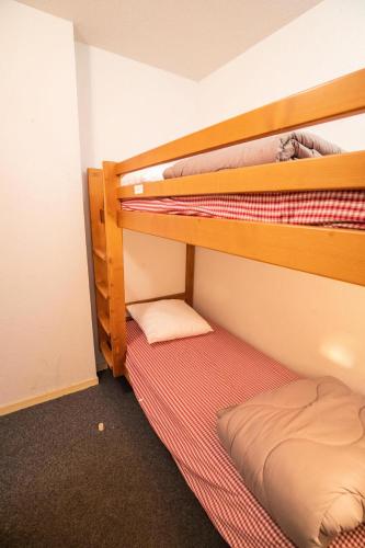 two bunk beds in a room with a bed at Résidence Belvedere Busseroles - RESIDENCE LE BELVEDERE "BUSSEROLES" - BELVB06 MAE-3071 in Modane