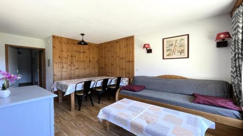 a living room with a couch and a table and chairs at Résidence Dame Blanche - 3 Pièces pour 6 Personnes 664 in Narreyroux