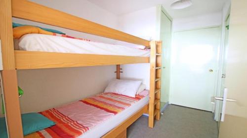 Ένα ή περισσότερα κρεβάτια σε δωμάτιο στο Résidence Sapporo - SAP408 - STUDIO COIN MONTAGNE - 4 PERSONNES AVEC BALCON SUD MAE-8904