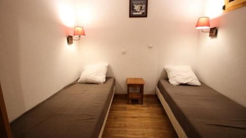 מיטה או מיטות בחדר ב-Résidence Dame Blanche - 2 Pièces pour 6 Personnes 404