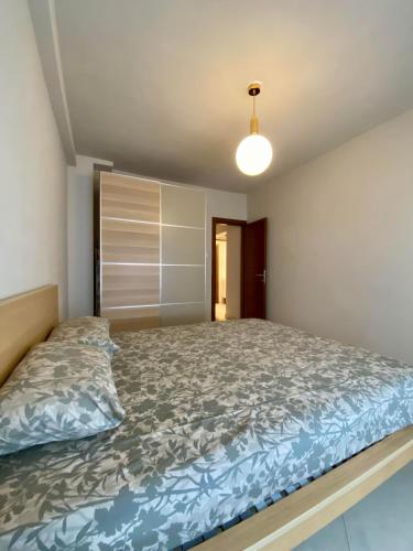 a bedroom with a large bed in a room at Orion White Tower Apartment in Thessaloniki