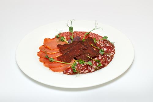 a plate of food on a white plate at Aristokrat in Vinnytsya