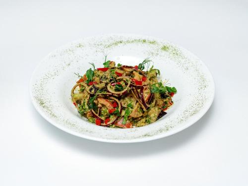 a white bowl filled with food on a white background at Aristokrat in Vinnytsya