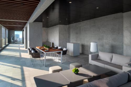 a living room with a couch and a table at New World Guangzhou Hotel-- FREE Canton Fair Shuttle Bus in Guangzhou