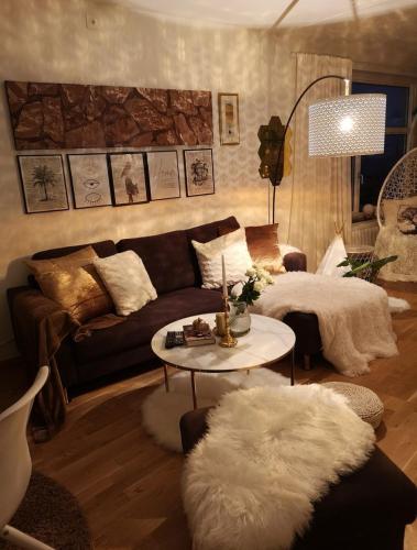 a living room with a couch and a table at Eurovision 2024 in Malmö