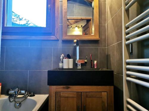 a small bathroom with a sink and a sink at Résidence Terrasse - La Terrasse 36 - Magnifique appartement cocooning, vue splendide MAE-4914 in Valmorel