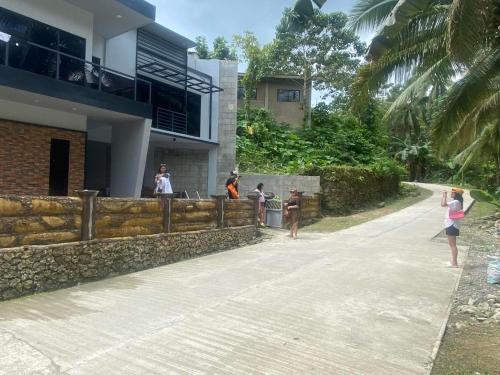 a group of people standing outside of a building at Altavista Resthouse 