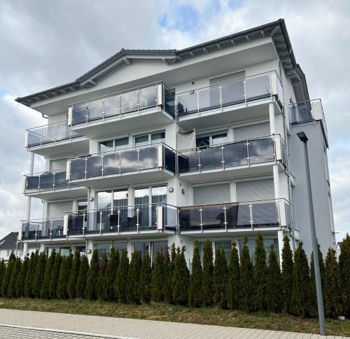 a white apartment building with balconies on it at MY HOME N 35 in Villingen-Schwenningen