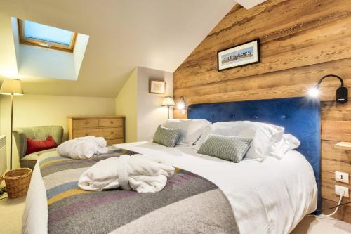 a bedroom with two beds with towels on them at Résidence Les Arcs Le Village - maeva Home - Duplex pièces - Exclusive 721 in Arc 1950