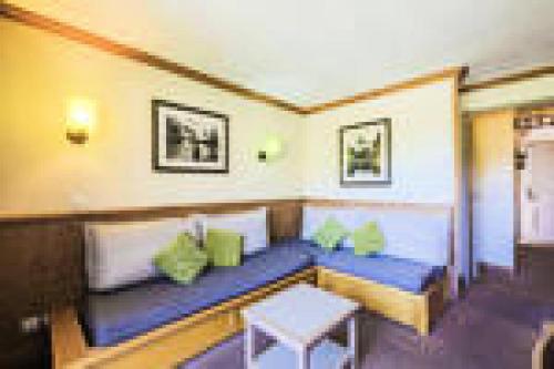 a living room with a couch and a table at Quartier La Forêt - maeva Home - Appartement 2 pièces 5 personnes - Sélection MAE-5271 in Valmorel