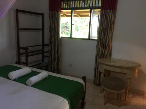 Ein Bett oder Betten in einem Zimmer der Unterkunft Greeny Villa