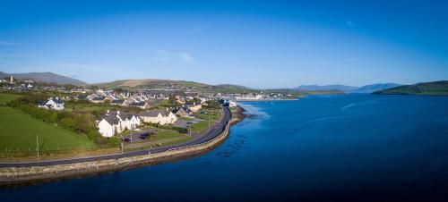 an aerial view of a town next to a body of water at Castlewood House in Dingle