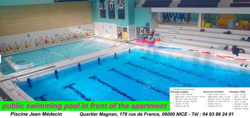 une piscine intérieure en face de l'auditorium dans l'établissement BEAUTIFUL renovated apartment ,NEXT TO THE BEACH ! AIR-C, FREE PARKING!, à Nice