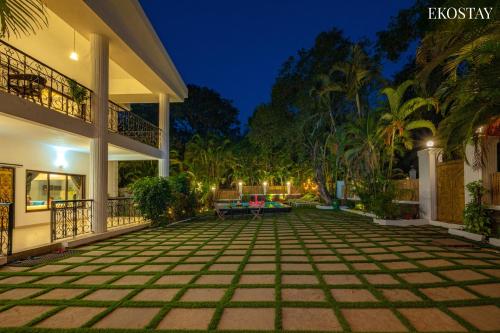 an empty courtyard of a house at night at Ekostay Luxe - CASA SIA - Ideal for Weddings - Poker Table in Lonavala