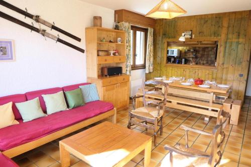 a living room with a couch and a table at Résidence Les Planes - 4 Pièces pour 8 Personnes 06 in Saint-Gervais-les-Bains
