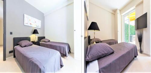 - 2 lits dans une chambre avec des couvertures violettes dans l'établissement Ô Paladium Two Bedroom Cannes, à Cannes