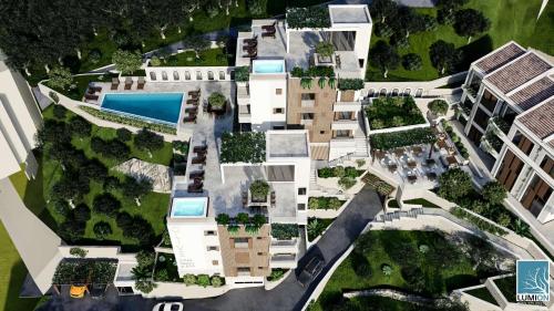 an overhead view of an apartment complex with buildings at Regent Resort Budva in Pržno