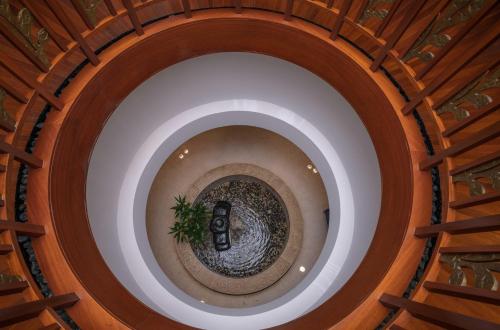 an overhead view of a spiral stairway at The Diplomat Radisson Blu Residence in Manama