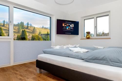 En eller flere senge i et værelse på Berg Fux - Ferienwohnung Francis der Esel