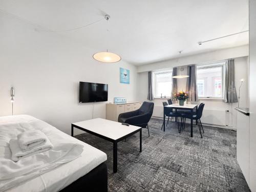 Телевизор и/или развлекательный центр в Hotel Nordbo