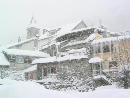 a snow covered building with snow on top of it at Résidence Lienz - Studio cabine avec terrasse exposée Sud MAE-8324 in Barèges