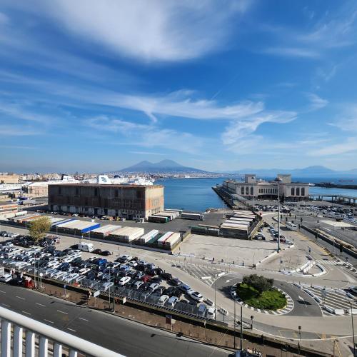a city with a parking lot and a body of water at Mia Suites Hotel Bella Capri in Naples