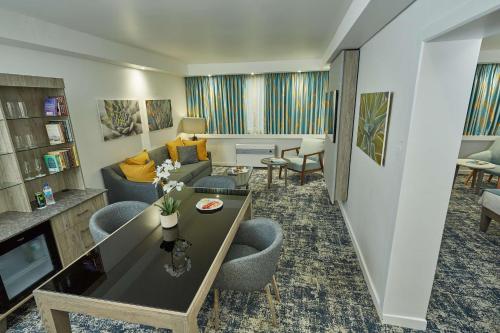 a living room with a couch and a table at Garden Court Mthatha in Mthatha