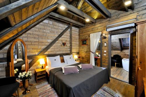 a bedroom with a large bed in a room at Lakeside Hotel Plitvice in Plitvička Jezera