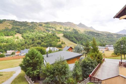 an aerial view of a village with mountains in the background at Residence Le Thymel - Studio pour 3 Personnes 14 in Valloire