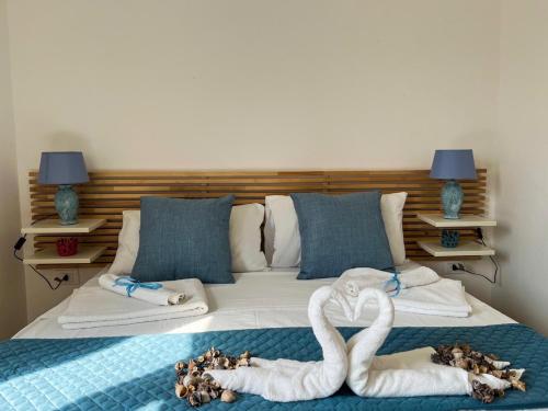 Postel nebo postele na pokoji v ubytování Appartamenti Calliope