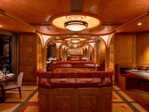 a room with a bar in a train at Mondrian Hong Kong in Hong Kong