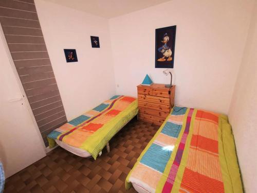 A bed or beds in a room at Résidence Maisons Des Sables 4 - 3 Pièces 6 couchages PORT LEUCATE. Réf: 2MS4_64 MAE-4924