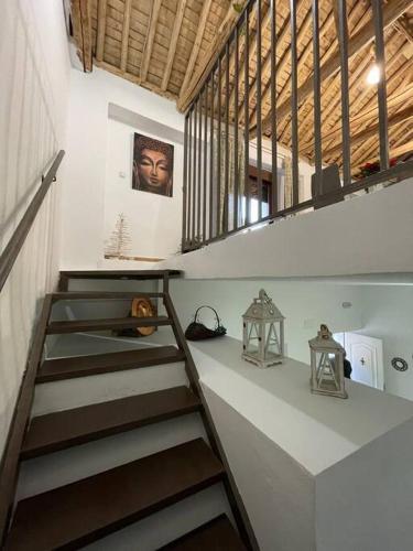 a staircase in a room with a stair case at Acogedor Apartamento/Loft en Santa Fe in Santa Fe