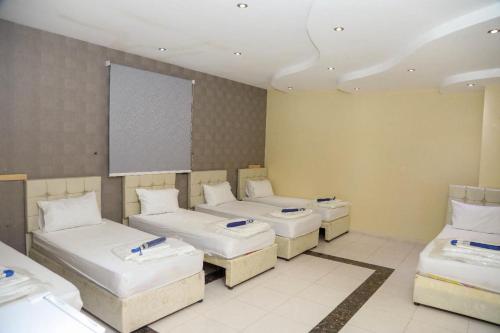 Krevet ili kreveti u jedinici u okviru objekta Ritaj Al Haramain 3