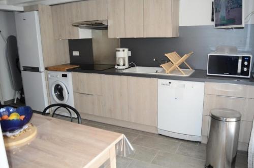 Kuchyň nebo kuchyňský kout v ubytování Résidence Maisons De La Plage - Magnifique villa pour 6 personnes entre plage et centre à Port Leucate. Réf: 1MPL_137J MAE-6464