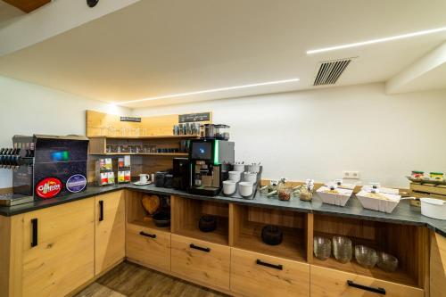 Kuchyň nebo kuchyňský kout v ubytování Sontheims Naturhotel & Spa