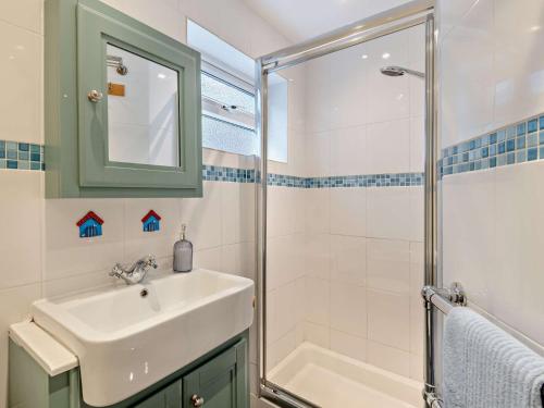 a bathroom with a sink and a shower at 2 Bed in Seasalter WCC05 in Seasalter