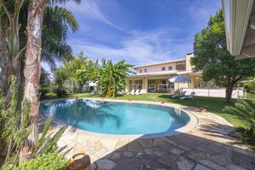 a swimming pool in the yard of a house at Villa Reginella in Lecce