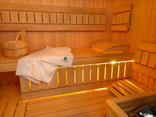 A bed or beds in a room at Aura - Hotel & Restaurant & Sauna