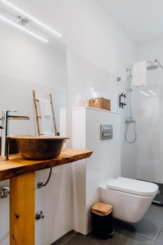 a bathroom with a sink and a toilet at Quinta do Louredo - Évora in Évora