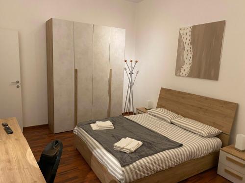 Ένα ή περισσότερα κρεβάτια σε δωμάτιο στο CasaTua 2