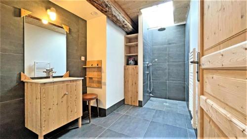 a bathroom with a sink and a shower at Résidence Maison - Maisons & Villas pour 8 Personnes 094 in Vallouise