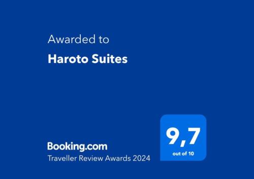 a screenshot of the halo suites app with a blue background at Haroto Suites in Tripití