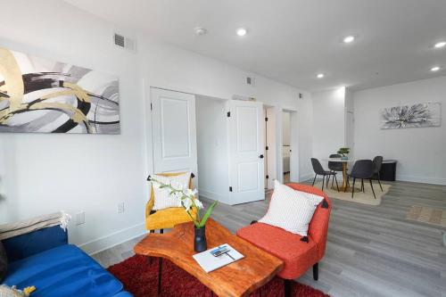 a living room with two chairs and a table at Enjoy City Skyline Views from private RoofDeck! in Washington