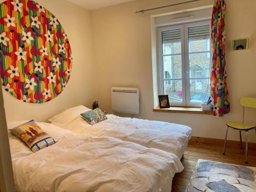 En eller flere senge i et værelse på Maison de village - MadreMia ! A proximité de Bagnoles de l'Orne